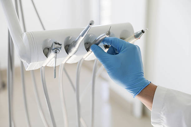 Professional Tooth Extraction technician working in Plattsburgh West, NY